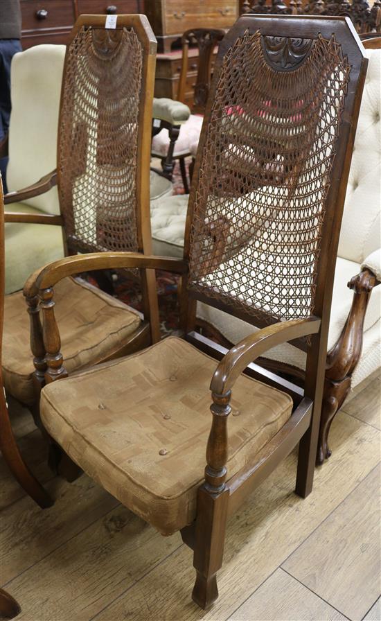 A pair of Art Deco style caned back armchairs